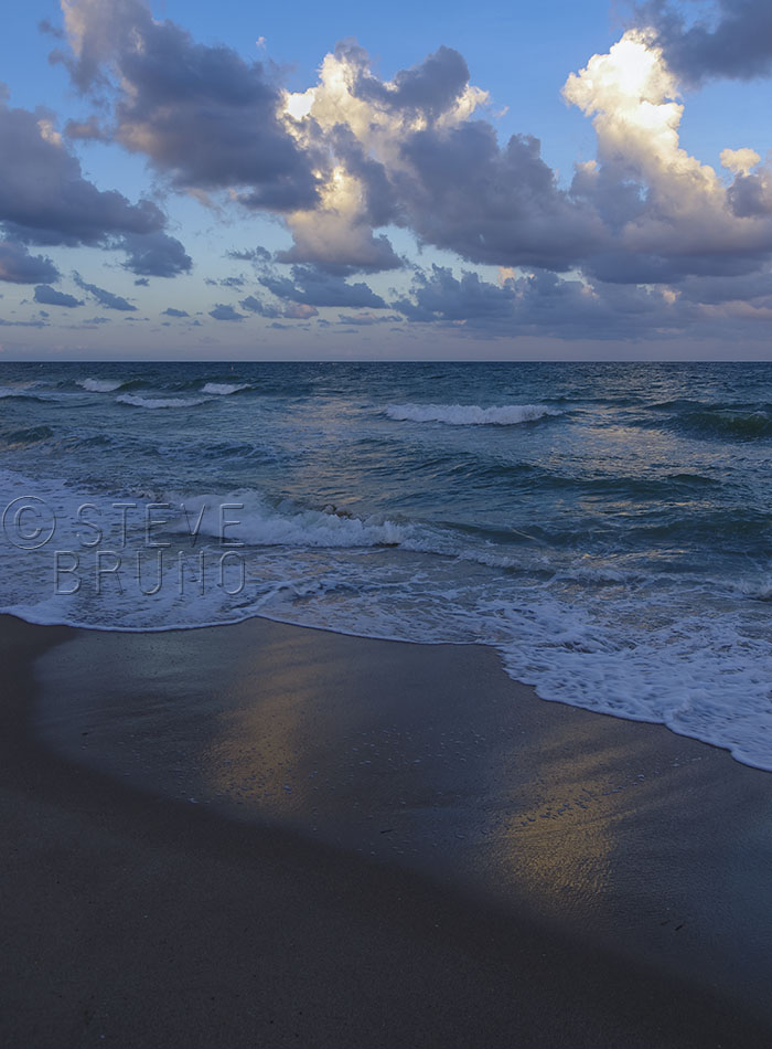 Setting sun illuminates part of the cloud cover over the Atlantic Ocean. Photo by Steve Bruno.